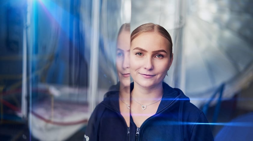 Aikon - woman in a blue hoodie